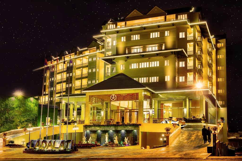 LADALAT Hotel illuminated at night.
